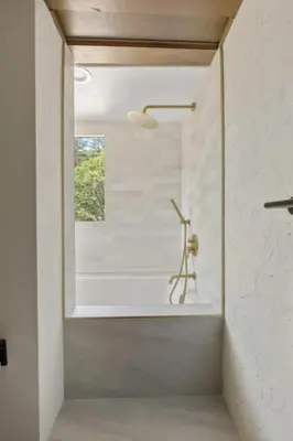 a bathroom with a bath tub and a window at Lake Reflection Point Upscale Lake House 4 Bed and 4.5 Bath in Lake Arrowhead