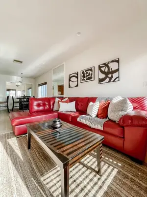 a living room with a red couch and a coffee table at *WEHO/Beverly Hills* Luxury 2BD/2.5BA + Balconies in Los Angeles
