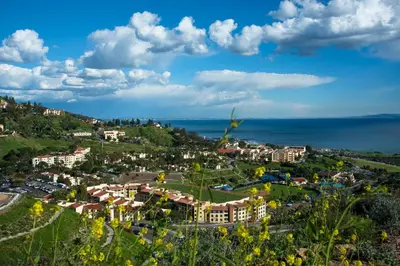 a view of a resort with the ocean in the background at Villa Graziadio Executive Center at Pepperdine University in Malibu