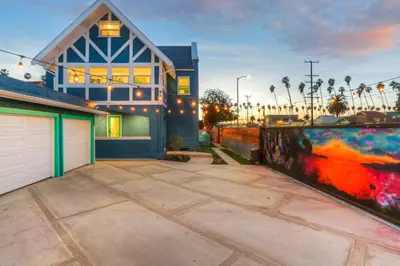 a large house with a garage in front of it at Peace Palace 56 in Los Angeles