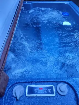 a close up of a swimming pool with a remote control at Merri Bear in Big Bear Lake