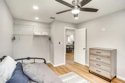 a bedroom with a bed and a ceiling fan at Rental with Pool Access about 8 Mi to Disneyland in La Palma