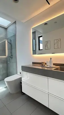 a bathroom with a toilet and a sink and a shower at Luxurious Venice Oasis Home in Los Angeles