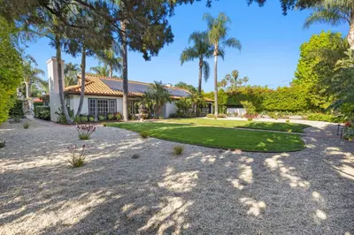 a house with palm trees and a yard at Erwin Estate in Los Angeles