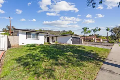 a white house with a large yard at Modern Relaxing Retreat with Private Pool home in Azusa