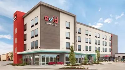 an office building with a va hospital sign on it at avid hotel Victorville Hesperia by IHG in Victorville