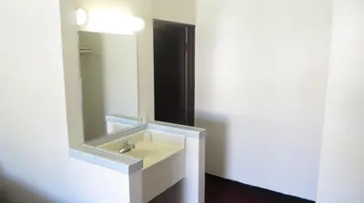 a bathroom with a sink and a mirror at Eagle Rock Motel in Los Angeles
