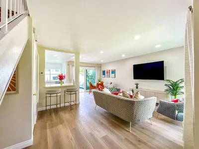 a living room with a couch and a tv at Sweet 2 bd for monthly stay! 20 mi to Disney in Diamond Bar