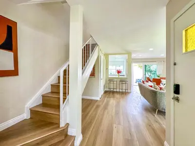 a room with a staircase and a living room at Sweet 2 bd for monthly stay! 20 mi to Disney in Diamond Bar
