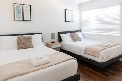 a bedroom with two beds and a window at 2BD/2BA Apartment in DT ALhambra in Alhambra