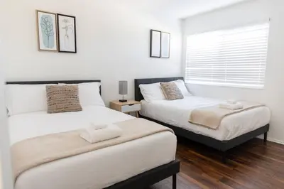 a bedroom with two beds and a window at 2BD/2BA Apartment in DT ALhambra in Alhambra