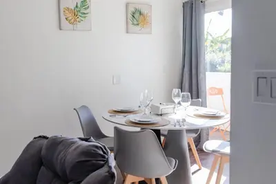 a dining room with a white table and chairs at 2BD/2BA Apartment in DT ALhambra in Alhambra