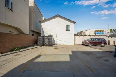a car parked in a parking lot next to a building at 130 Anderson St B in Sunset Beach