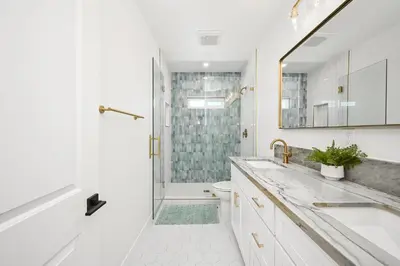 a bathroom with a shower and a sink and a toilet at Brand New Home by the Beach & Historic Sunset Water Tower in Sunset Beach