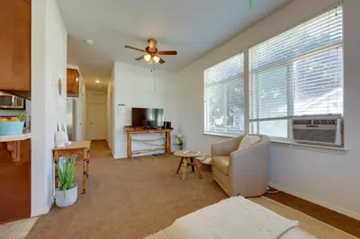 a living room with a couch and a ceiling fan at Cozy Oak View Getaway about 5 Mi to Ojai Valley! in Oak View