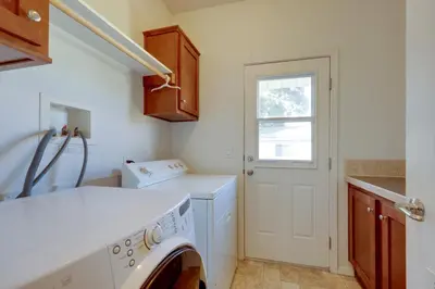 a laundry room with a washing machine and a window at Cozy Oak View Getaway about 5 Mi to Ojai Valley! in Oak View