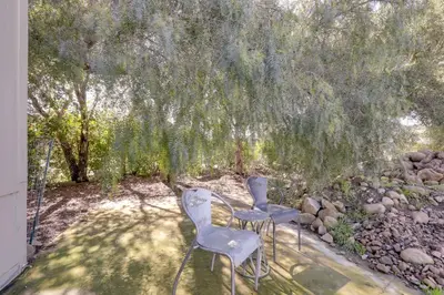 two chairs and a table under a tree at Cozy Oak View Getaway about 5 Mi to Ojai Valley! in Oak View