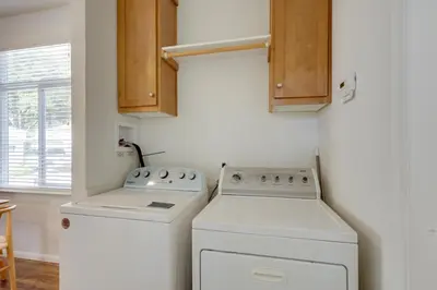 a small laundry room with a washer and dryer at Charming Oak View Retreat about 5 Mi to Ojai Valley! in Oak View
