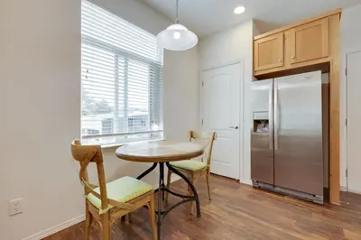 a kitchen with a table and chairs and a refrigerator at Oak View Vacation Rental about 3 Mi to Lake Casitas! in Oak View