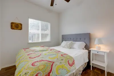 a bedroom with a bed and a nightstand and a window at Oak View Vacation Rental about 3 Mi to Lake Casitas! in Oak View