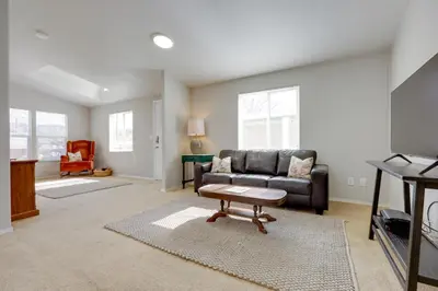 a living room with a couch and a table at Oak View Home - Close to Beaches and Trails! in Oak View