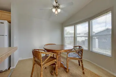 a dining room with a table and two chairs at Oak View Home - Close to Beaches and Trails! in Oak View