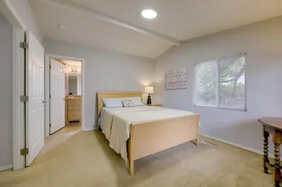 a bedroom with a bed and a window at Oak View Home - Close to Beaches and Trails! in Oak View