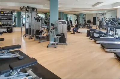 a gym with a row of treadmills and machines at Partial Ocean View Steps to the Pier in Los Angeles