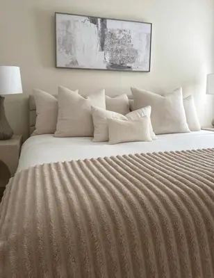 a bedroom with a large bed with white pillows at Partial Ocean View Steps to the Pier in Los Angeles