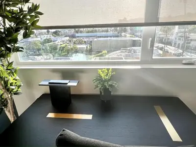 a room with a table and a large window at Hollywood Sign View 2 Bed 2 Bath Premium Corner in Los Angeles