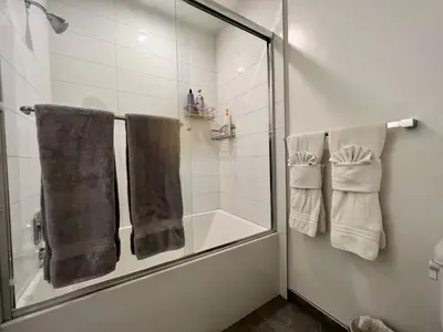 a bathroom with a shower with towels and a shower at Large Hollywood Corner 2 Bedroom with Private Balcony in Los Angeles