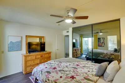 a bedroom with a bed and a large mirror at 1 Mi to the Ocean Long Beach Condo with Pool Access in Long Beach