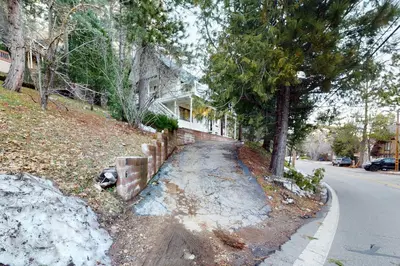 a house on the side of a street at The Snow White in Lake Arrowhead