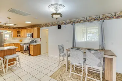 a large kitchen with a table and chairs at Family-Friendly Loma Linda Retreat Walk to LLU in Loma Linda