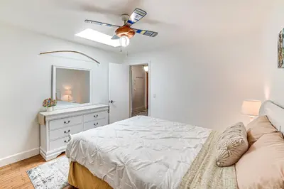 a bedroom with a bed and a ceiling fan at Family-Friendly Loma Linda Retreat Walk to LLU in Loma Linda