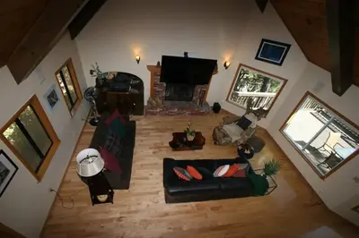 an overhead view of a living room with a couch and a fireplace at Outrageous Lake View Villa pets ok in Lake Arrowhead