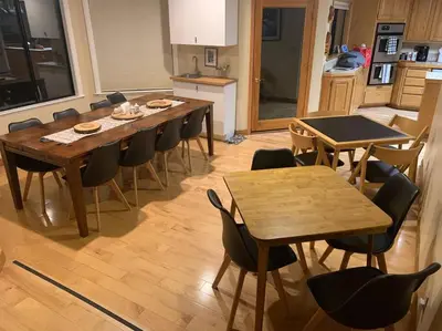 a dining room with tables and chairs in a kitchen at Outrageous Lake View Villa pets ok in Lake Arrowhead