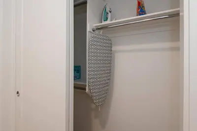 a door of a closet with a tie on it at Comfy Apt with pool & hot tub in downtown LA' in Los Angeles