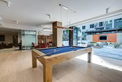 a large living room with a pool table at Comfy Apt with pool & hot tub in downtown LA' in Los Angeles