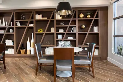 a dining room with a table and chairs and shelves at Playa Vista 1br w gym pool table nr beach LAX-1123 in Los Angeles