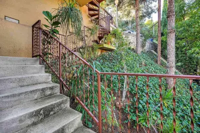 a set of stairs leading up to a house at Secret Stairs Studio #1 in Los Angeles