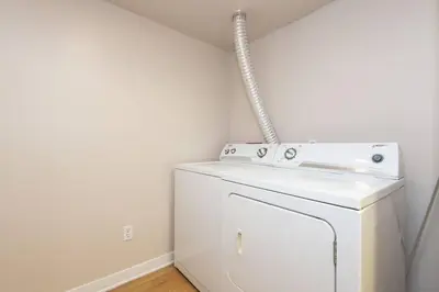 a white washer and dryer in a room at Comfy Cozy Apt with pool & hot tub in downtown LA' in Los Angeles