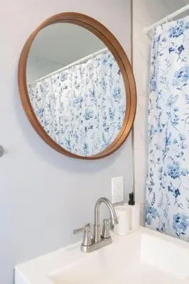 a bathroom with a mirror over a sink at Lovely 3bedroom condo with free parking on premise in Los Angeles