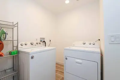 a kitchen with two white appliances and a refrigerator at Lovely 2bedroom condo with free parking on premise in Los Angeles