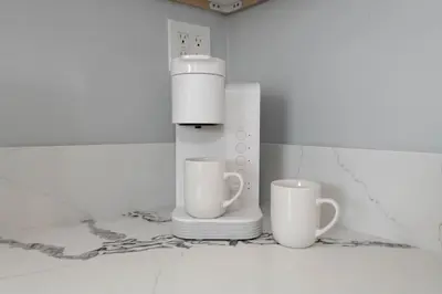 a blender and two cups sitting on a counter at Lovely 2bedroom condo with free parking on premise in Los Angeles