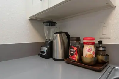 a kitchen counter with a blender on a shelf at Hollywood 2Bed Apt w Rooftop pool & Panoramic View in Los Angeles