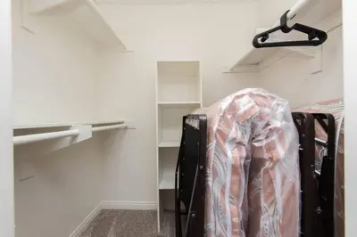 a room with a closet with shelves and a suitcase at Hollywood 2Bed Apt w Rooftop pool & Panoramic View in Los Angeles