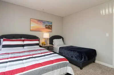 a bedroom with a bed and a bed sidx sidx sidx sidx at Hollywood 2Bed Apt w Rooftop pool & Panoramic View in Los Angeles
