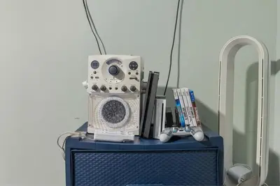 a radio on top of a blue tv at Voted Airbnb Most Loved Home 2024 Duffy Boat in Huntington Beach