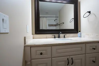 a bathroom with a sink and a mirror at Destination #06 in Anaheim